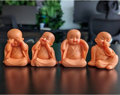 set 4 pink little monk buddha statues.jpg